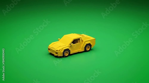 Yellow toy sports car model slowly zooming out on a green screen background.