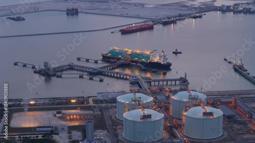 LNG (Liquified Natural Gas) tanker anchored in Gas terminal gas tanks for storage. Oil Crude Gas Tanker Ship. LPG at Tanker Bay Petroleum Chemical or Methane freighter export import transportation