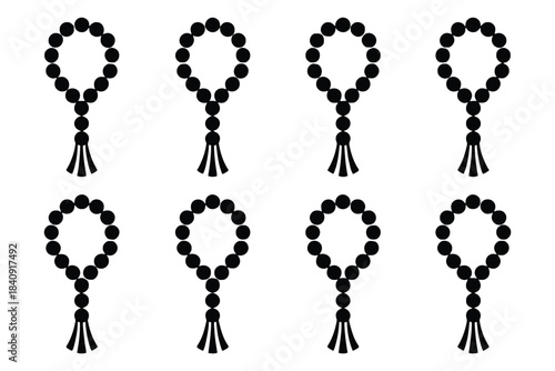 Eight black Islamic prayer beads with tassels on white background rosary tasbih