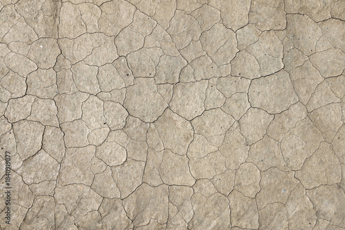 Close up view of mud flat with narrow cracks for environmental background use.