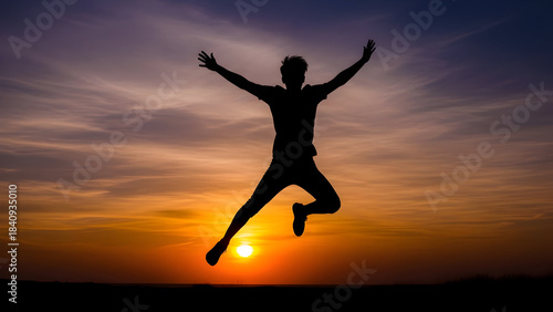 Wallpaper Mural Silhouette of a man jumping in the air against a vibrant sunset sky Torontodigital.ca