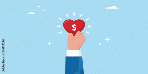 A hand gently holds a red heart with a dollar sign inside it