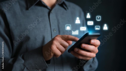 Wallpaper Mural Person Using Smartphone for Communication and Social Media Interaction in Dark Background Torontodigital.ca