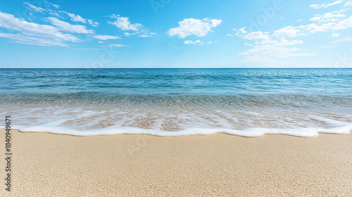 Fototapeta Naklejka Na Ścianę i Meble -  Calm shore open smooth sand sea blue sky relaxing moment