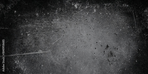 Monochromatic grunge is heavily distressed creating a moody dramatic vintage atmosphere.