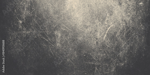 Monochromatic grunge is heavily distressed creating a moody dramatic vintage atmosphere.