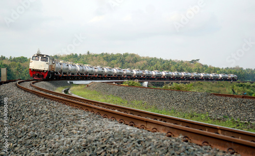 A fast-moving train glides smoothly along the railway tracks, showcasing power, motion, and precision in transportation