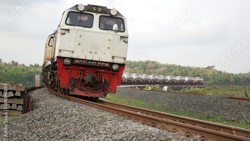 A fast-moving train glides smoothly along the railway tracks, showcasing power, motion, and precision in transportation