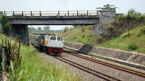 A fast-moving train glides smoothly along the railway tracks, showcasing power, motion, and precision in transportation