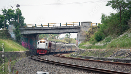 A fast-moving train glides smoothly along the railway tracks, showcasing power, motion, and precision in transportation
