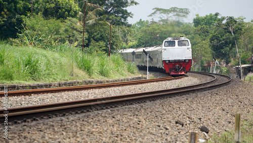 A fast-moving train glides smoothly along the railway tracks, showcasing power, motion, and precision in transportation