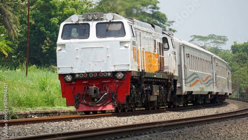 A fast-moving train glides smoothly along the railway tracks, showcasing power, motion, and precision in transportation