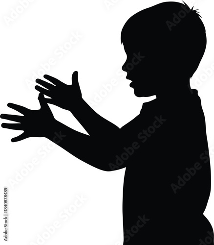 Silhouette of a boy playing with hands