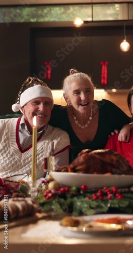 Christmas, dinner and happy family in home with photography for memories, bonding and holiday tradition. People, smile and picture in house for festive party, social media xmas post and connection.