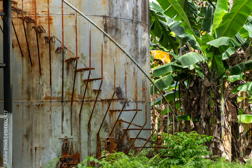 old rusted stairs on a storage tank