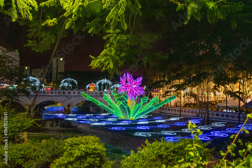 Cali, Colombia, December 10, 2025. Traditional Christmas lights in Cali, Colombia. Christmas lights in Cali, Colombia, festive decorations, crowded nighttime celebration in public park.