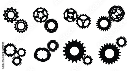 A collection of black and white gears arranged in a scattered pattern