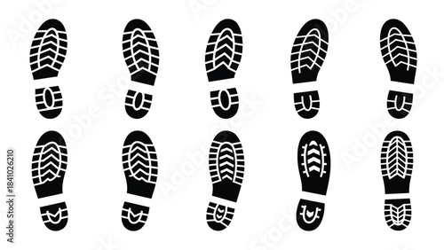 A collection of various black shoe sole prints arranged in neat rows