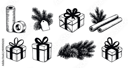 Collection of Christmas gift boxes, pine branches, and wrapping paper rolls for festive holiday packaging and seasonal decoration projects