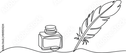 Black and white feather and inkwell quill writing