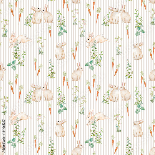 Watercolor seamless pattern with cute bunnies, carrots and green herbs on beige stripes. Hand-painted spring design perfect for nursery wallpaper, Easter decor, fabric and wrapping paper.