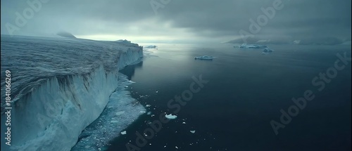 Conceptual: Massive Glacier Cliff and Icebergs in Cold Arctic Waters under a Dramatic Sky.
