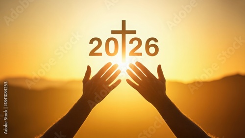 Hands reaching towards cross and year 2026 at sunset