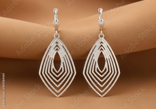 Elegant silver dangle earrings with geometric diamond shape