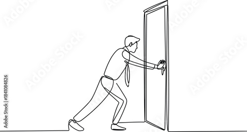 Man in suit pushing open a door with both hands