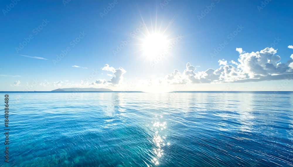 Fototapeta premium Sunny day over ocean, bright sun with reflective water