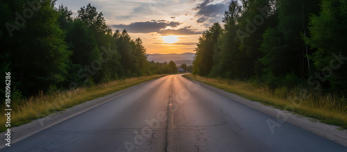 Winding Road Through Forest at Golden Hour
