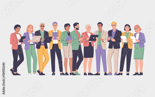 Diverse professionals from various backgrounds standing with laptops and tablets ready for business tasks