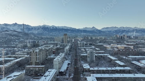 A drone view of the central part of the Kazakh city of Almaty before sunrise on a winter morning.
