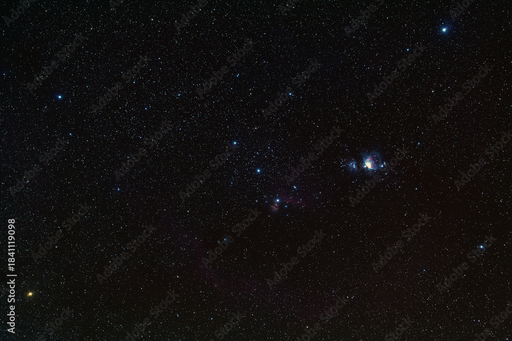 Obraz premium Night blue sky space background with great orion nebula (M42 ) and Running Man Nebula (M43) , Milky way galaxy with stardust field in deep universe