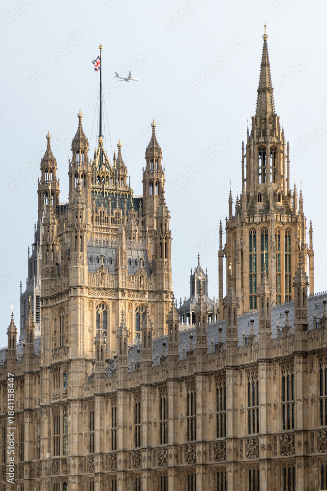 Fototapeta premium Palace of Westminster (the Houses of Parliament), its distinctive Gothic Revival architecture, characterized by intricate stonework and towering spires, This landmark serves as the meeting place for t