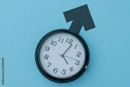 Clock on a blue background with a male gender symbol. Biological clock, aging, health issues, andropause, low testosterone concept.