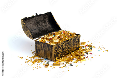 Golden ancient pirate treasure chest that is opened revealing chinese gold ingot bars scattered pile of gold pieces and sparkling colorful cut diamonds isolated on white background.