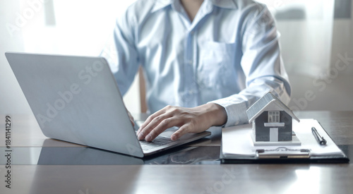 home dealer businessman signing home insurance document or lease paper. home loan and insurance concept