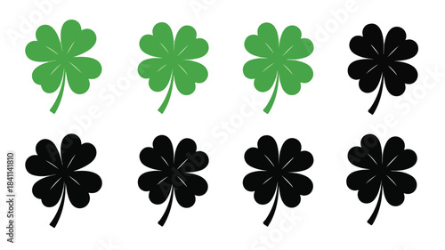 Flat lay of eight four-leaf clovers in two rows on a white background with green and black colors.