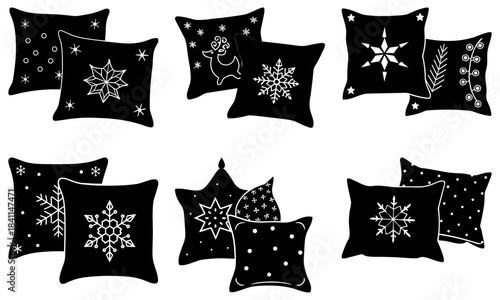 Set of black square and star-shaped pillows with white snowflake and star patterns on white background