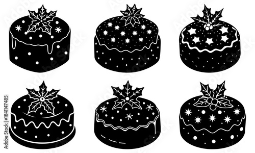 Christmas cakes with holly decorations on white background
