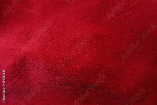 Surface of red velour cotton fabric from above