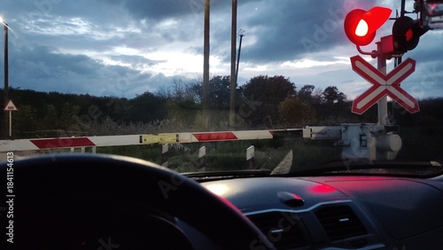 Working signal at a railroad crossing, prohibiting entry. View from inside a car. Video with sound
