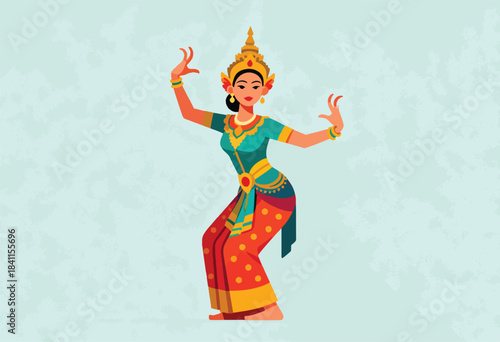 A graceful dancer in vibrant traditional attire strikes a pose, adorned with golden jewelry