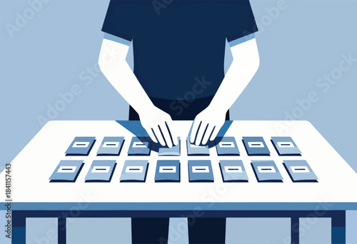 A person with hands over a collection of cards laid on a table in a monochrome blue scheme