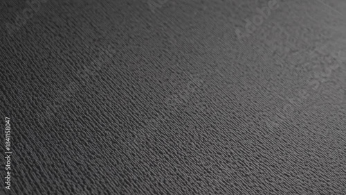 Close-up examination of textured surface showcasing detailed patterns and shadows in low light