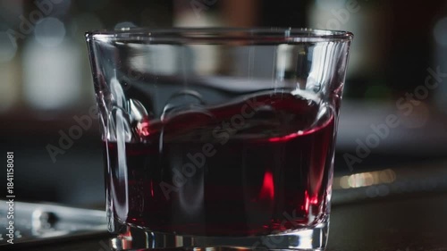 red wine swirls in the crystal glass