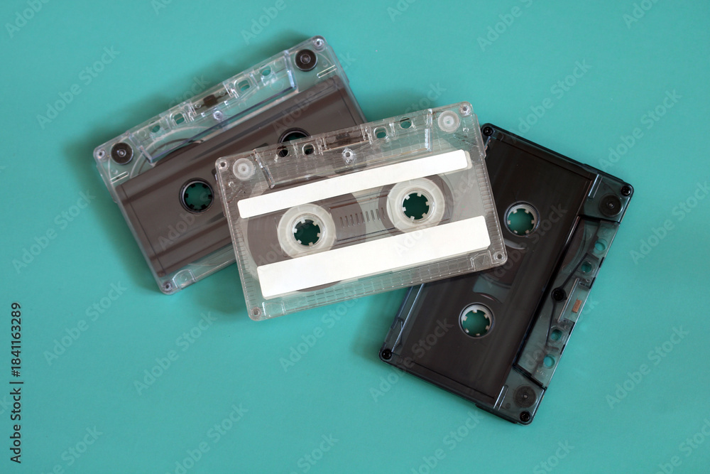 Fototapeta premium Three transparent cassette tapes retro audio storage