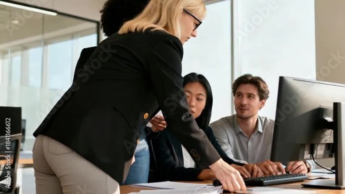 Wallpaper Mural Glandular blonde secretary in glasses looks at african female manager holding report. Indoor portrait of stylish black woman in jeans spending time with Asian and European colleagues in office Torontodigital.ca