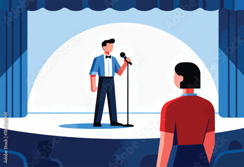 A performer with a microphone stands on a stage in front of an audience, spotlight on him, blue curtains